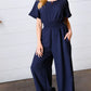 Dark Blue Smocked Waist Notch Neck Crepe Jumpsuit - DAVERRI FASHIONS