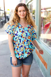 Blue & Orange Flat Floral V Neck Top | Daverri Fashions