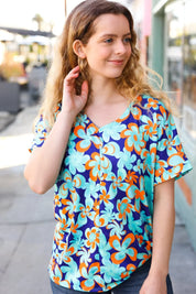 Blue & Orange Flat Floral V Neck Top | Daverri Fashions