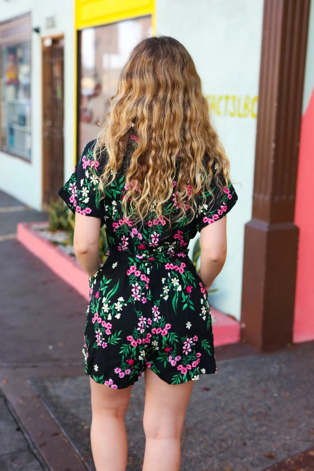 Black & Floral Surplice Short Sleeve Pocketed Romper | Daverri Fashions