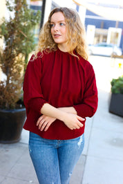 Bold Dreams Wine Smocked Three Quarter Sleeve Tie Back Top | Daverri Fashions