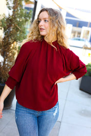Bold Dreams Wine Smocked Three Quarter Sleeve Tie Back Top | Daverri Fashions