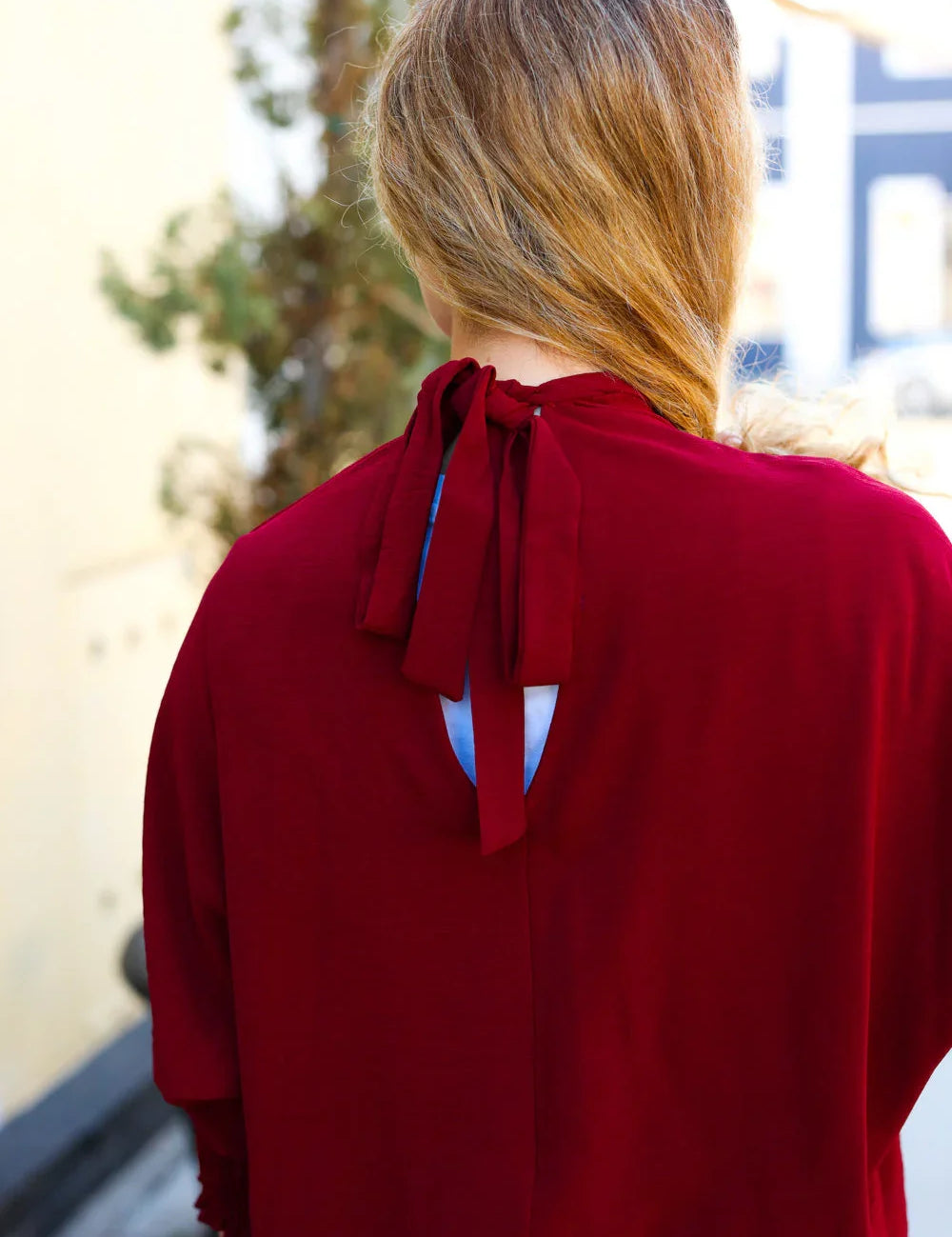 Bold Dreams Wine Smocked Three Quarter Sleeve Tie Back Top | Daverri Fashions