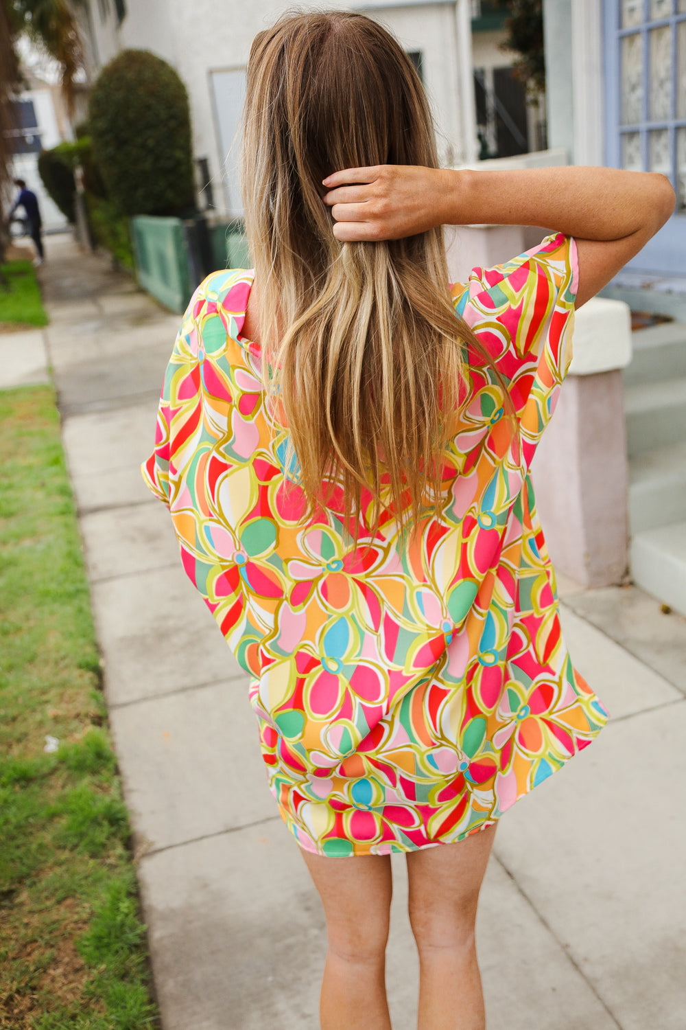 Vibrant casual chic multicolor abstract V-neck dolman sleeve top in floral pink, orange, yellow, green