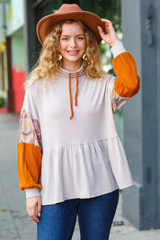 Taupe and rust turtleneck babydoll terry top with patterned sleeves