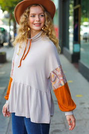 Light gray Taupe & Rust turtleneck babydoll terry top with orange patterned sleeves