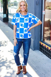 Turn Up The Volume Blue Football Checker Print Top | Daverri Fashions