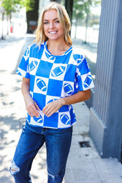 Turn Up The Volume Blue Football Checker Print Top | Daverri Fashions