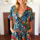 Navy Tropical Floral Surplice Romper - DAVERRI FASHIONS