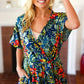 Navy Tropical Floral Surplice Romper - DAVERRI FASHIONS