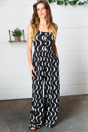 Black Abstract Wave Button Jumpsuit | Daverri Fashions