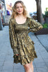 Gold sequined mini dress with ruffled hem and long sleeves