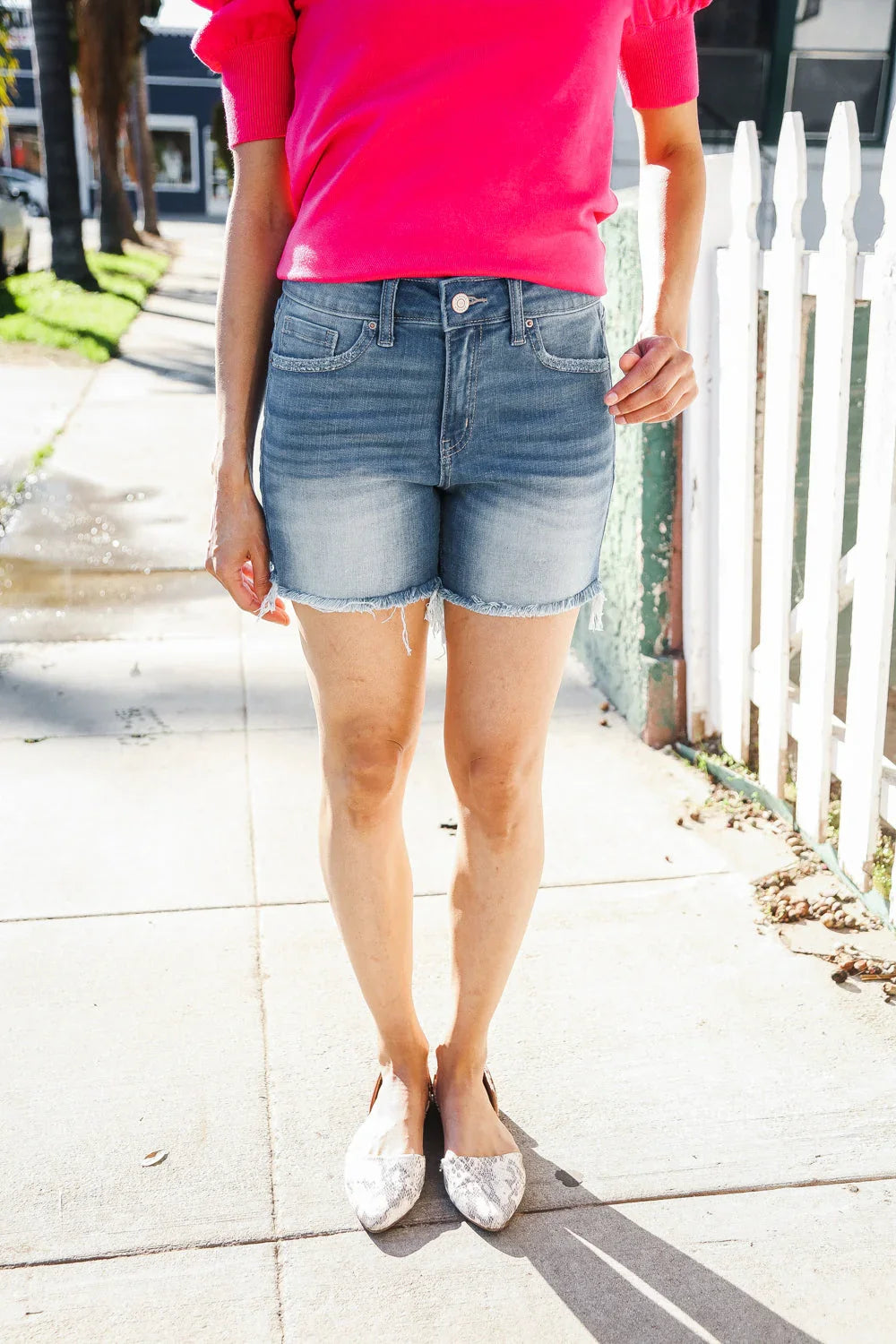 Dark Denim Mid rise raw frayed hem denim shorts | Daverri Fashions