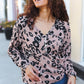 Blush pink long-sleeved henley top with black leopard print and silver buttons