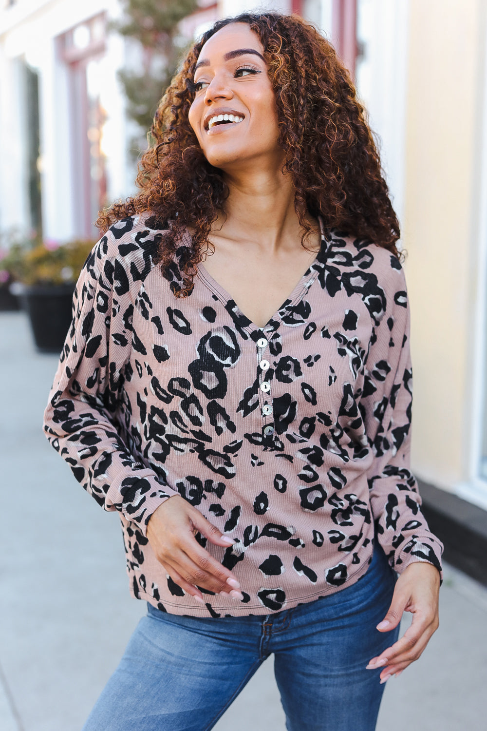 Blush pink long-sleeved henley top with black leopard print and silver buttons