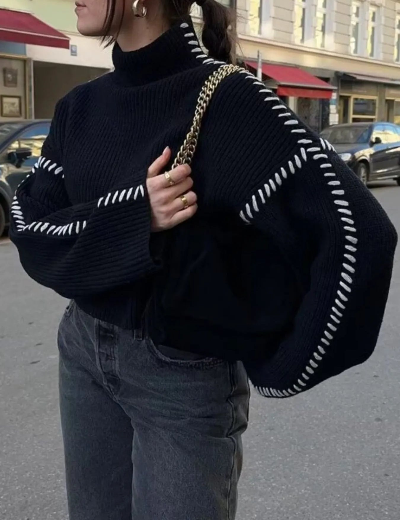 Black and white striped contrast mock neck sweater with oversized sleeves