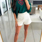 White high-waisted shorts with Daverri Fashions plaid trim blouse