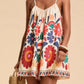Floral print spaghetti strap romper in cream with vibrant embroidered flowers