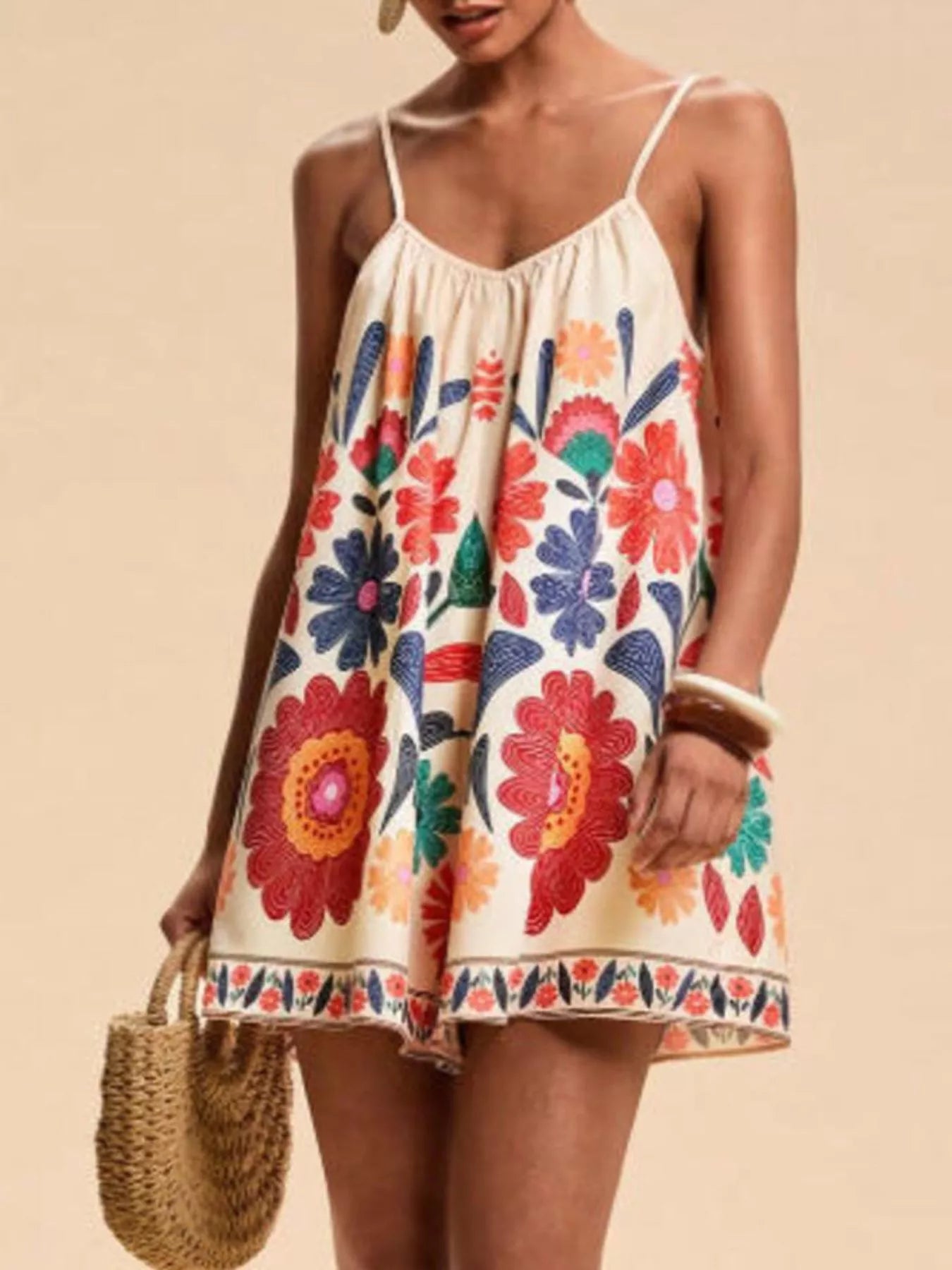 Floral print spaghetti strap romper in cream with vibrant embroidered flowers