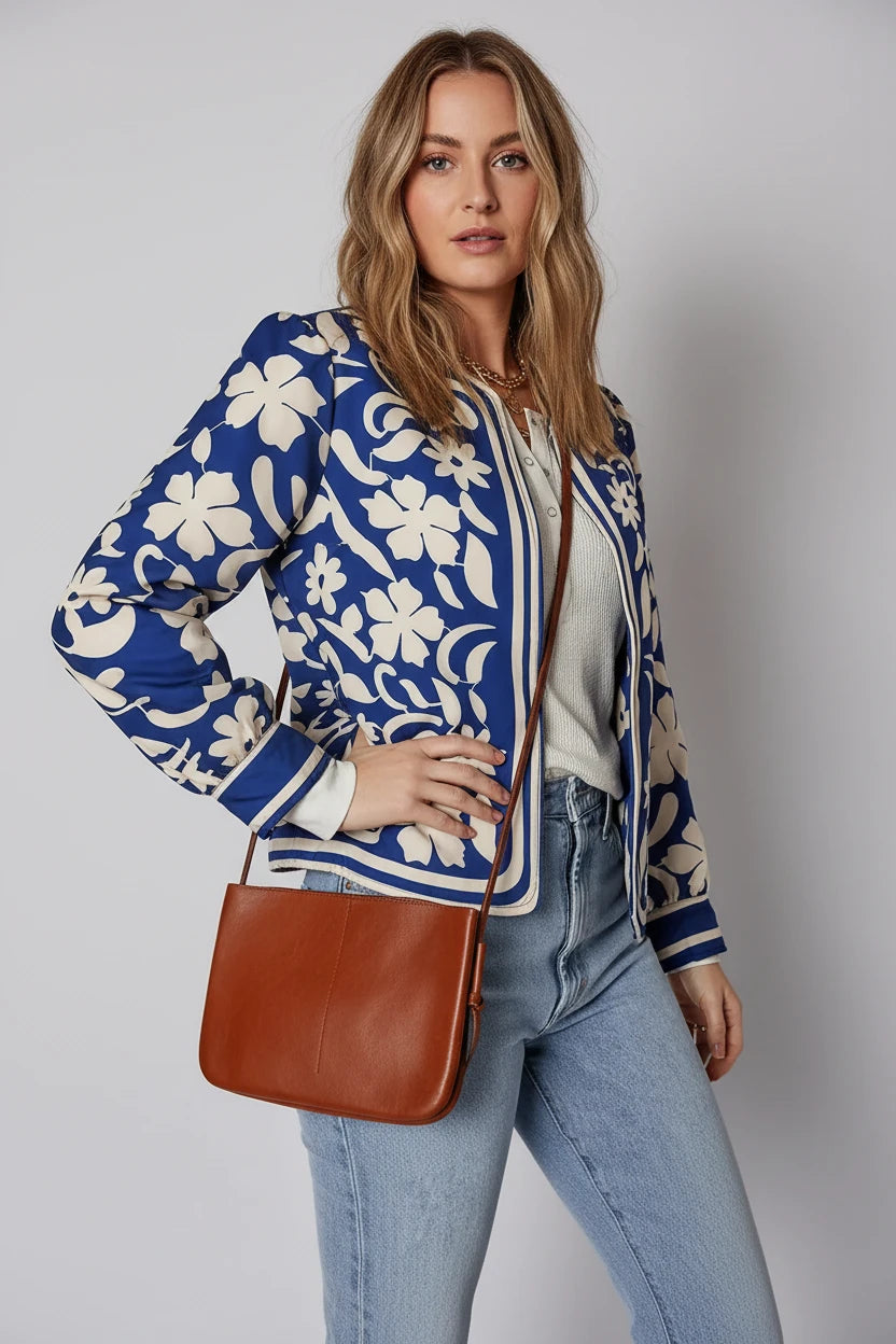 Brown leather crossbody bag with flower print jacket