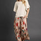Umgee boho top with flowing oatmeal satin pants in red green floral pattern