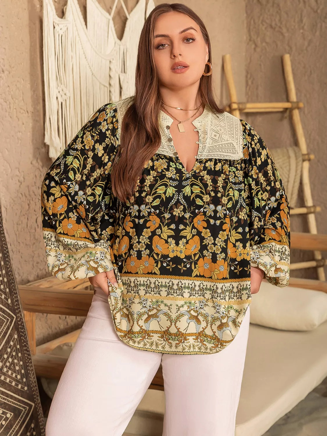 Plus size black floral print blouse with cream lace collar and v-neckline