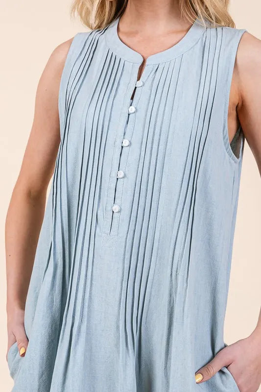 Light blue sleeveless midi dress with pintuck pleats and white buttons