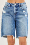 RISEN Tummy Control Slouchy Bermuda Shorts in blue denim with distressed patches and frayed hem