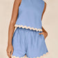 Daverri Fashions light blue sleeveless top with cream scalloped trim