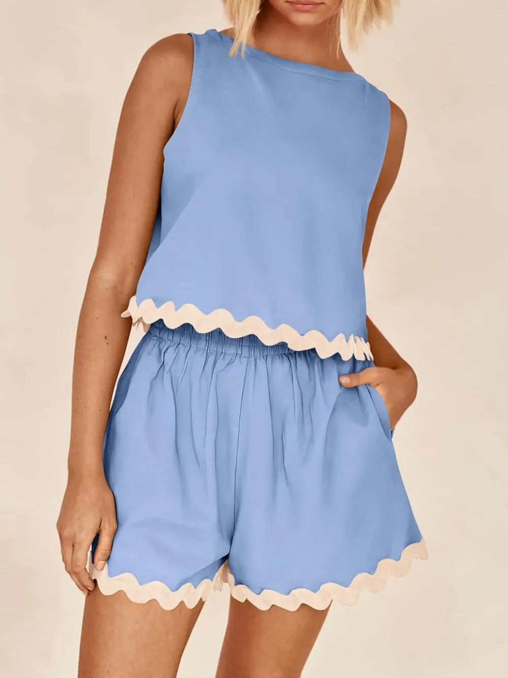 Daverri Fashions light blue sleeveless top with cream scalloped trim