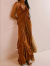 Ruffled halter neck maxi dress in flowing rust color with layered ruffles