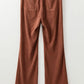 Women’s high-waist corduroy flared pants in rust with square back pockets