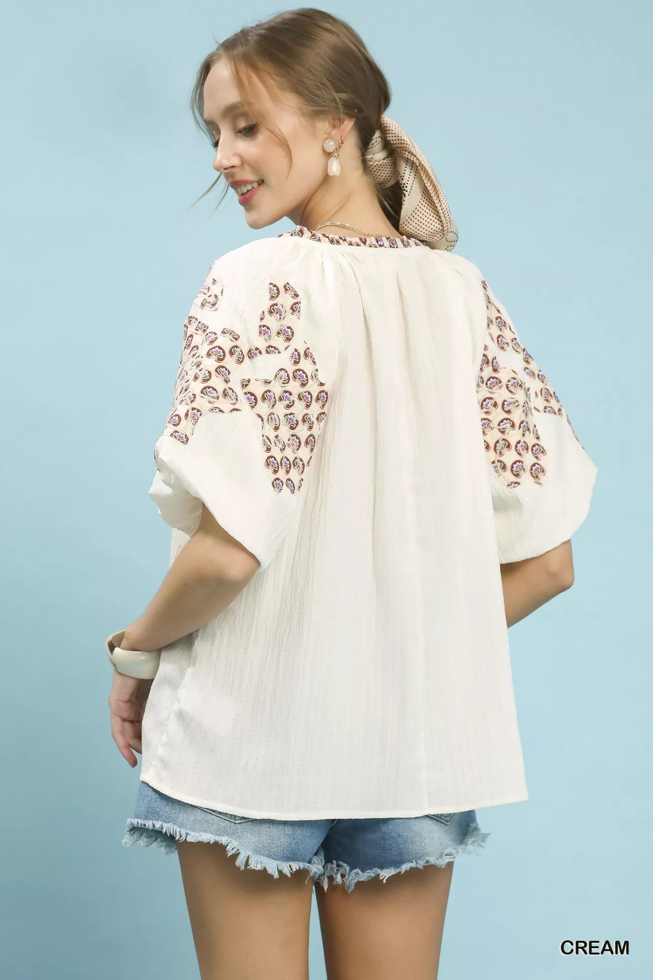 Umgee embroidered sleeve contrast trim top in cream with brown patterns