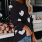 Black off-shoulder sweater with white heart patches, scoop neck long sleeve