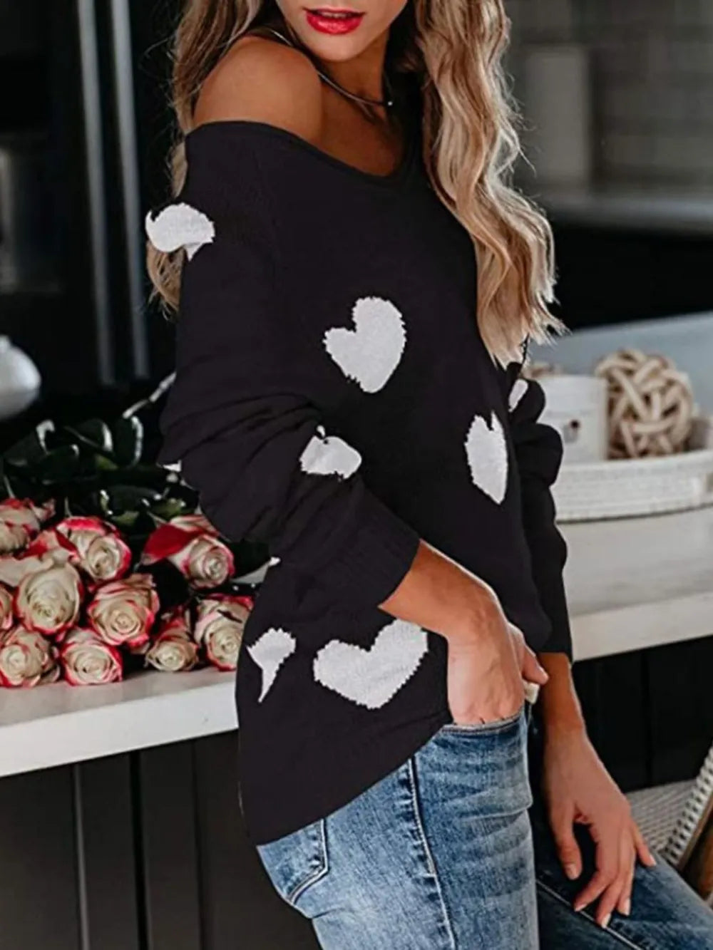Black off-shoulder sweater with white heart patches, scoop neck long sleeve