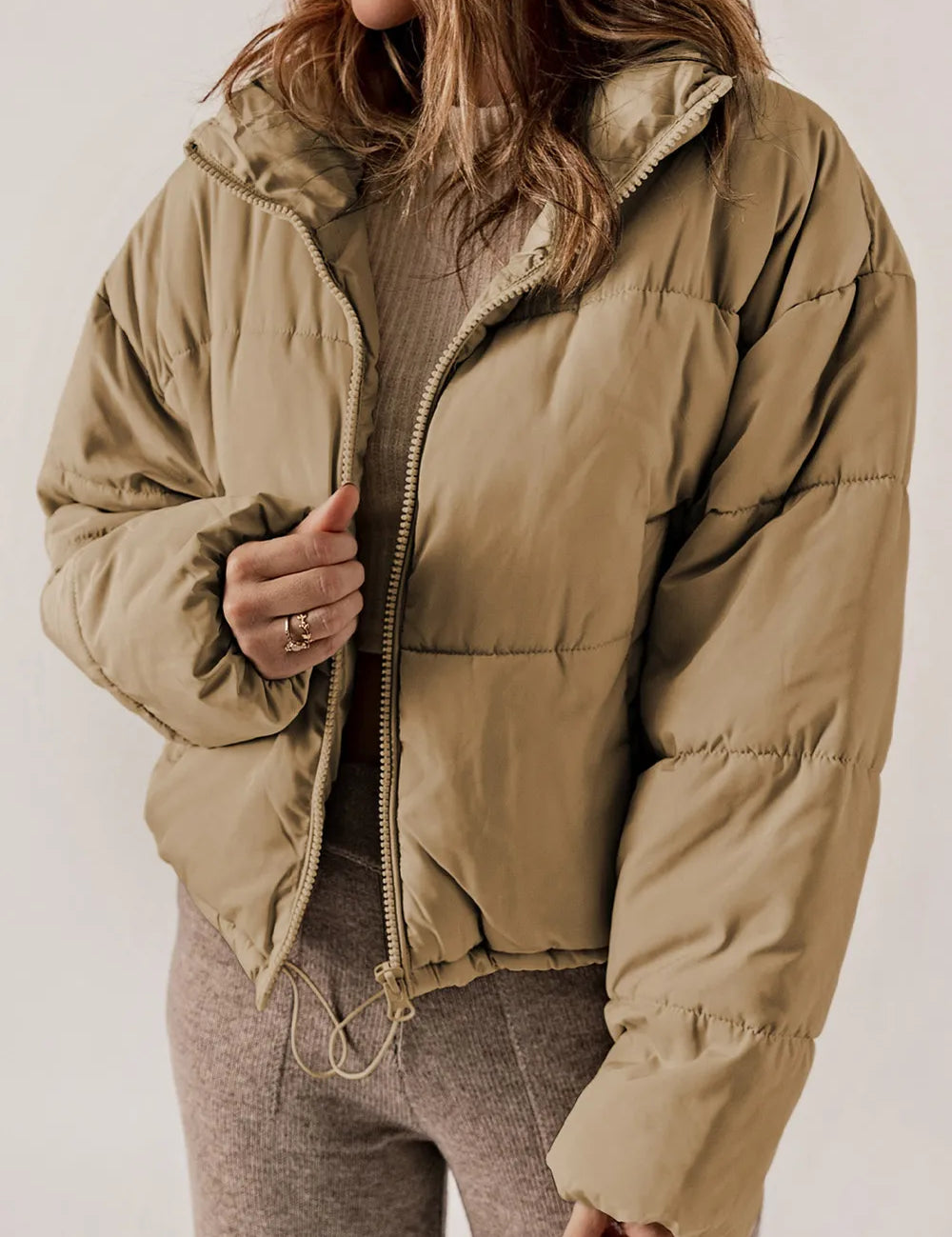 Khaki zip-up puffer jacket with hood and quilted fabric