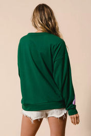 Emerald green oversized BiBi sequin pullover with pink purple back graphic