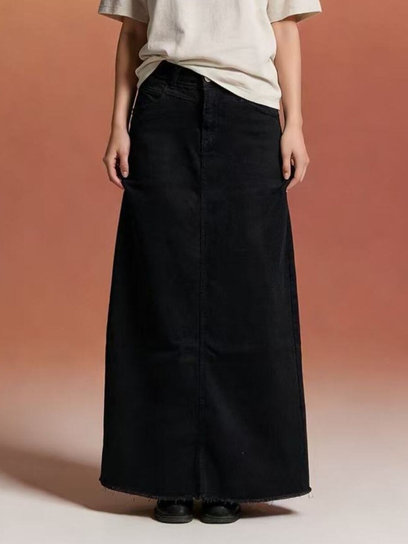 Black raw hem maxi denim skirt with straight cut and raw hem