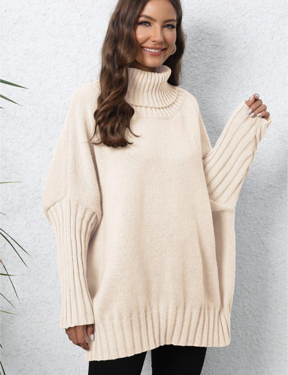 Cream oversized turtleneck sweater with ribbed cuffs and hem