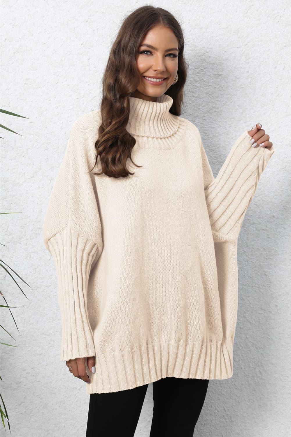 Cream oversized turtleneck sweater with ribbed cuffs and hem