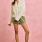 Cream lace blouse with geometric pattern on SO ME twill shorts