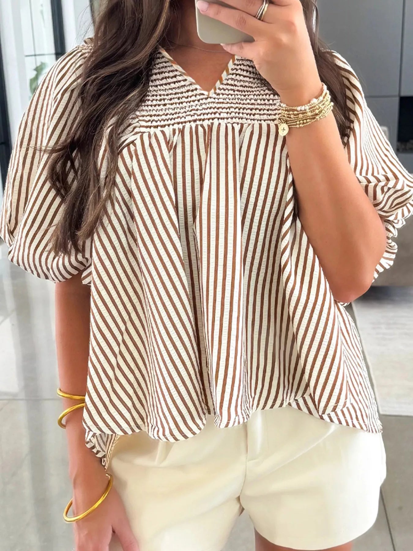 Striped V-neck puff sleeve blouse in beige and brown vertical stripes