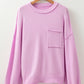 Lavender knit sweater with pink raw edge ribbed drop shoulder