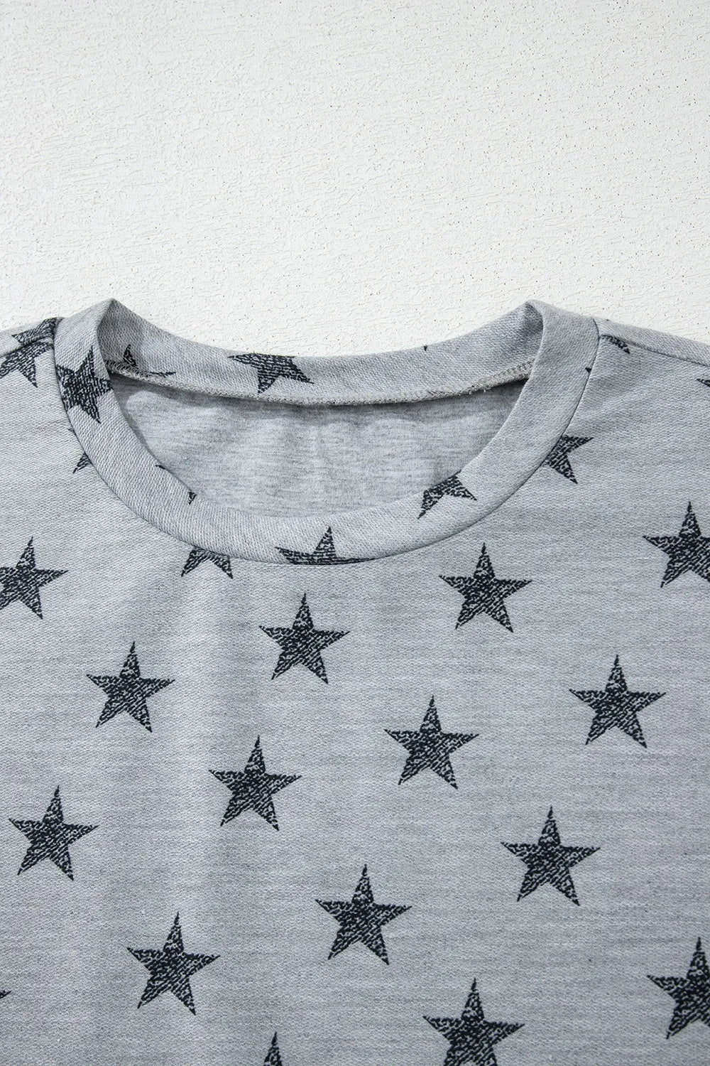 Gray star-patterned cotton crew neck t-shirt with ruffled sleeves