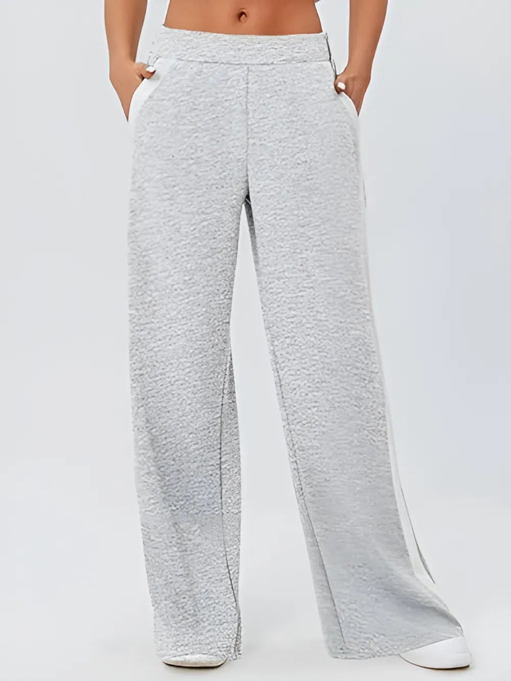 Gray heathered wide-leg sweatpants with white side stripes and pockets