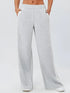 Gray heathered wide-leg sweatpants with white side stripes and pockets