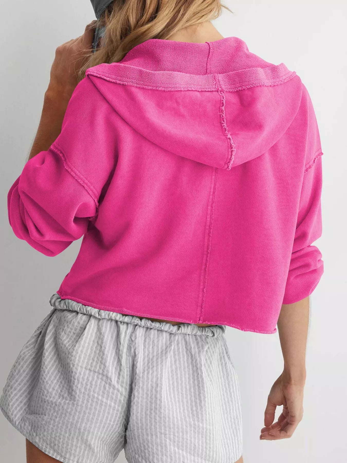 Vibrant pink Exposed Seam Dropped Shoulder Hoodie with distressed texture and ribbed cuffs