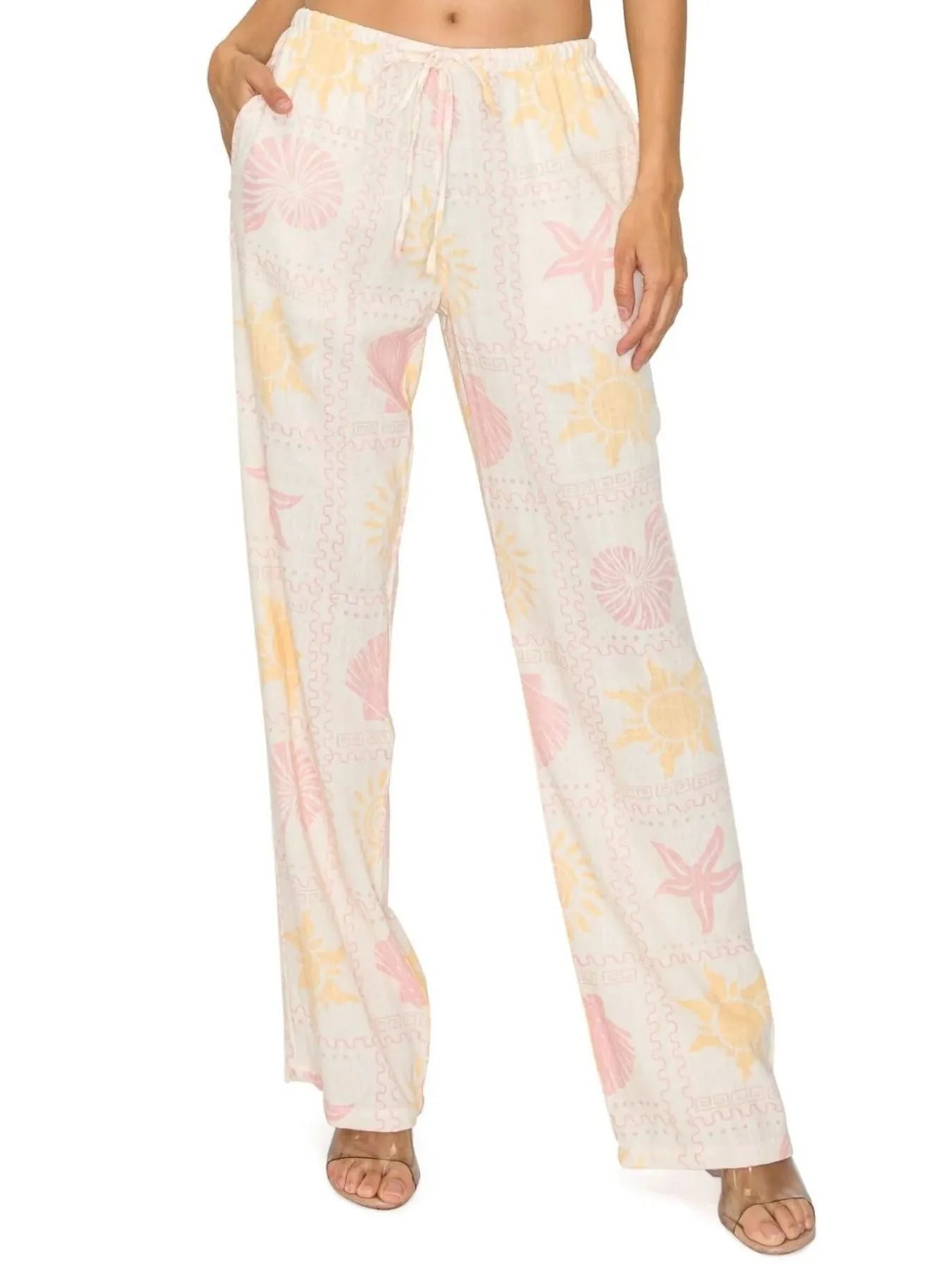 White printed drawstring straight pants with pink yellow seashell pattern
