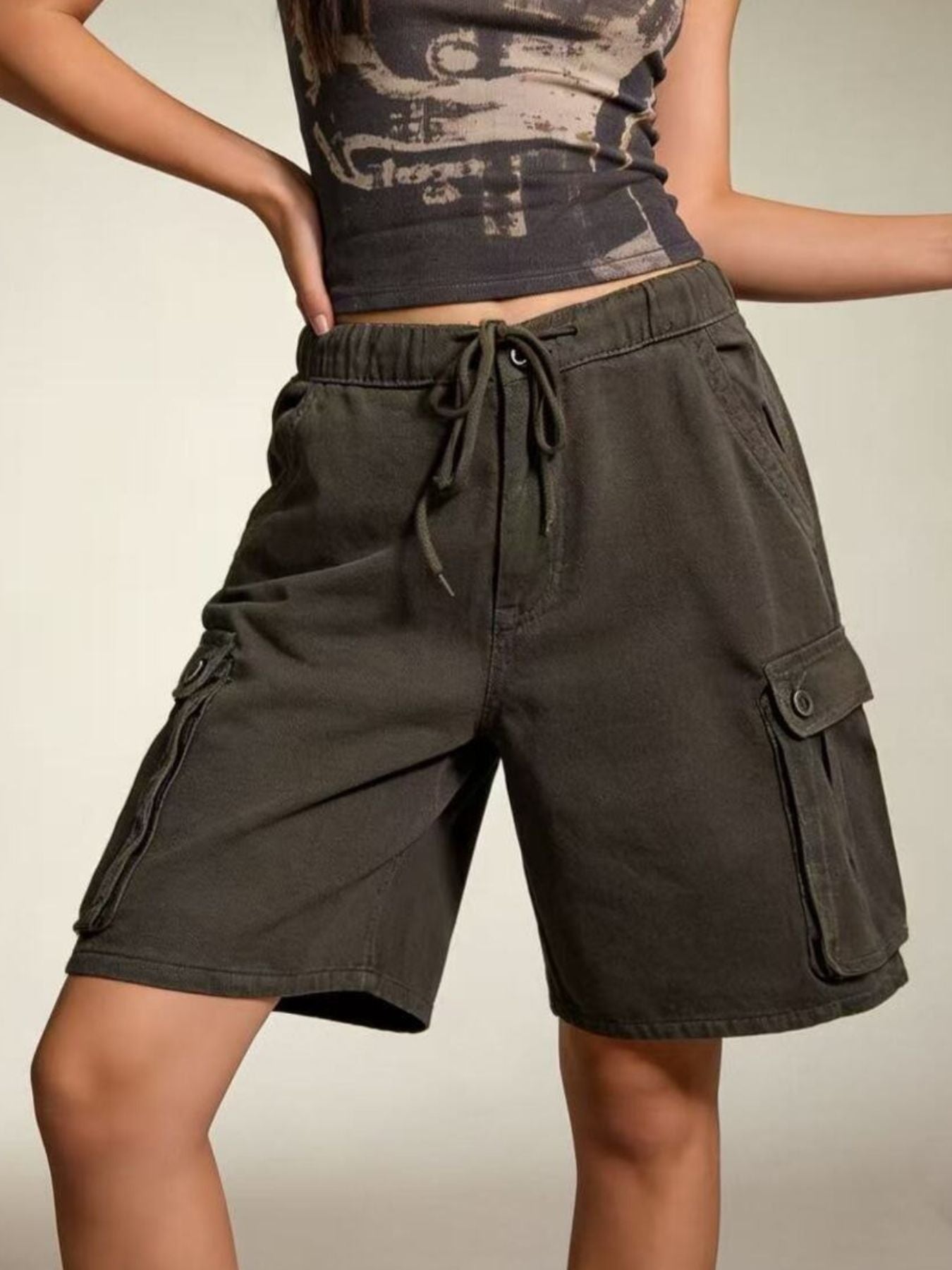 Olive green cargo shorts with drawstring waistband and pockets