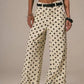 Daverri Polka Dot Wide Leg Jeans: cream trousers with black polka dots, belt